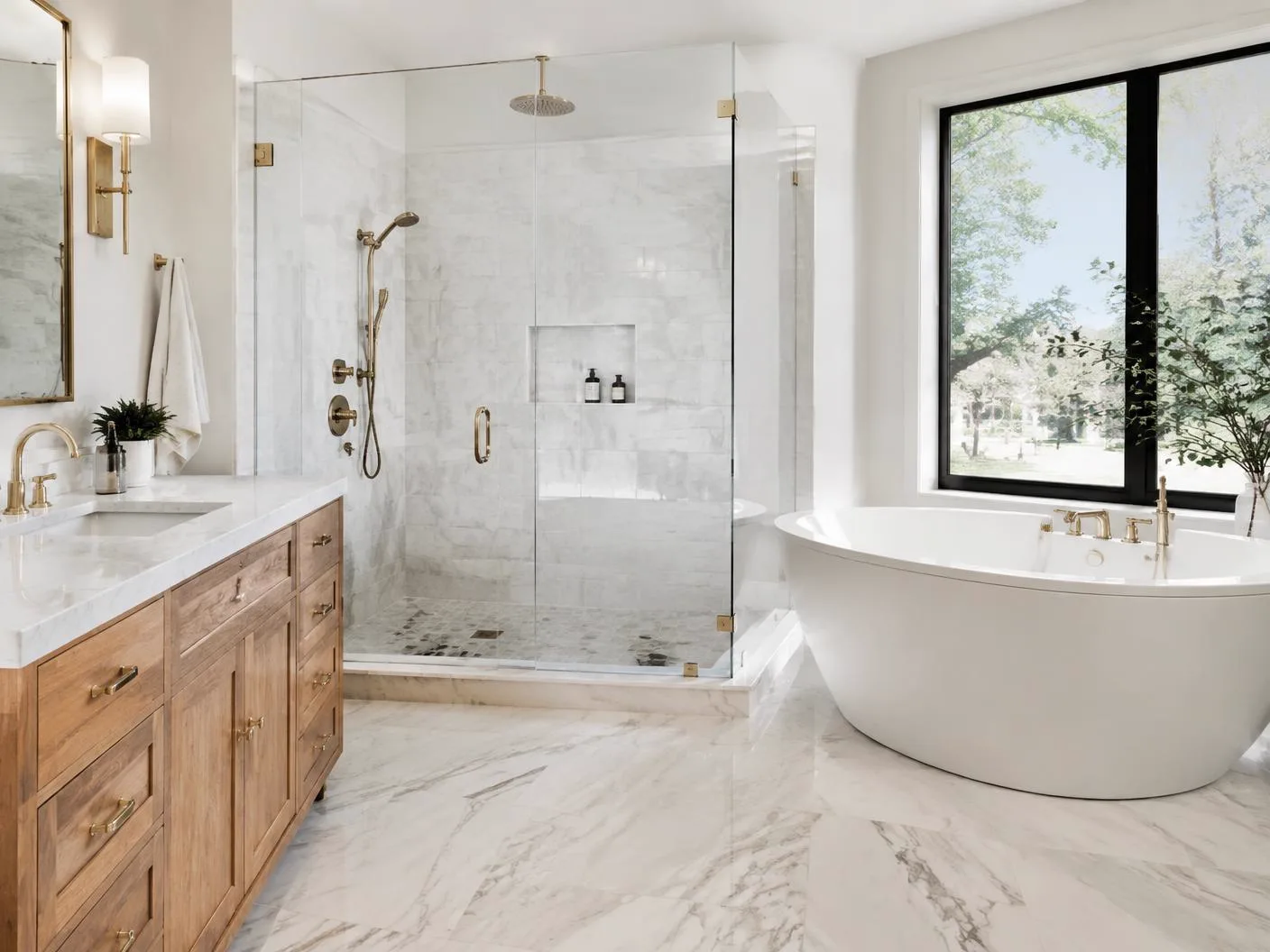 Finished bathroom with a glass walk-in shower, freestanding tub and wood vanity