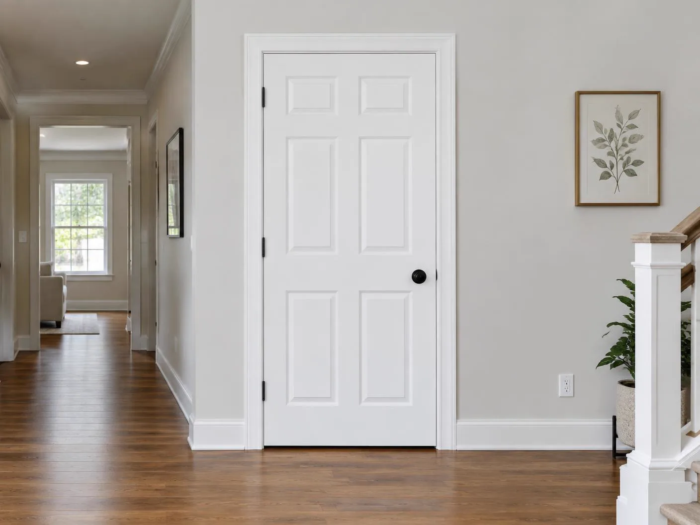 White paneled interior door with finished casing