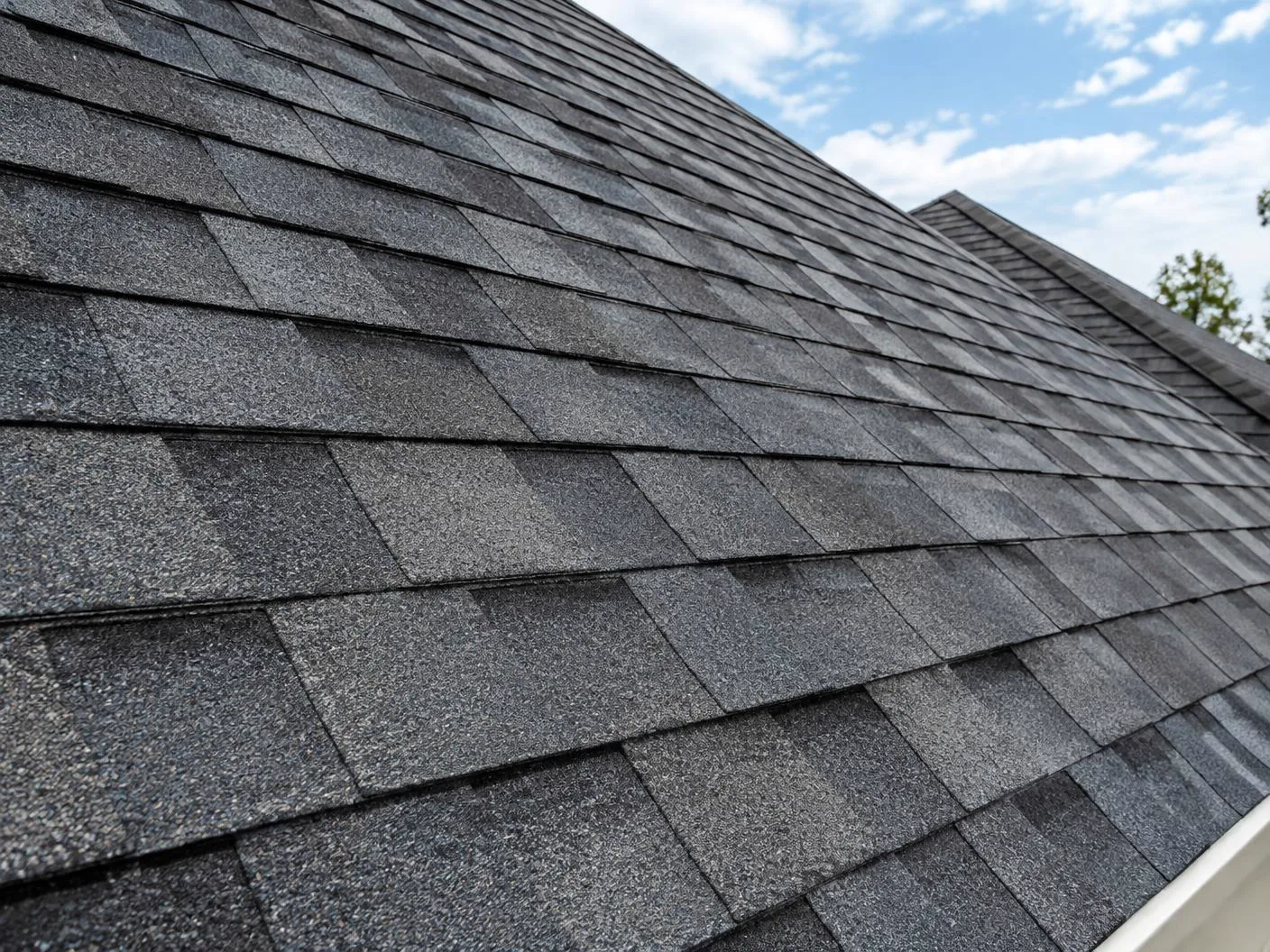 Close view of dimensional asphalt roof shingles